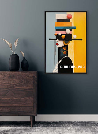 Framed "Bauhaus Woman 02" by David Wolf on a dark wall above a wooden dresser with minimalist decor.