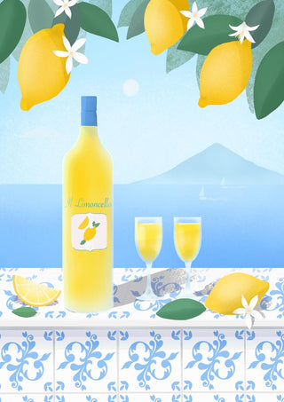Bottle of Limoncello with two filled glasses, lemons, and coastal scenery in the background.