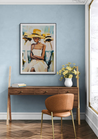 Framed Lady - David Wolf artwork above a wooden desk with flowers, chair, and blue accent wall.