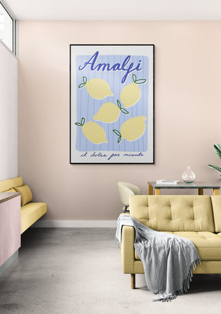 Framed Lemon Bliss Amalfi wall art with illustrated lemons, displayed above a modern living room sofa.