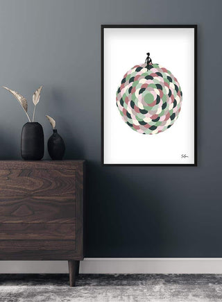 Framed Sara Sonne - Your World art poster with abstract circular design hanging above a dark wooden dresser.