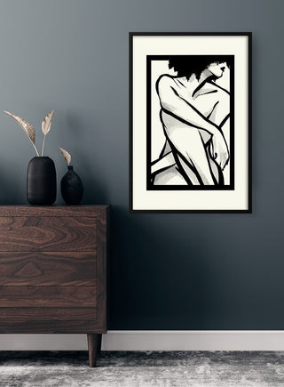 Framed "Shape of a Woman" poster featuring abstract black and white female form, displayed above a wooden dresser.