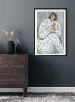 Framed "Endless Love" poster featuring abstract art of a person holding a heart, displayed in a modern room.