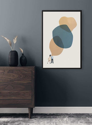 Framed "A thousand stories to tell you" art print by Maarten Léon hanging above a wooden dresser.