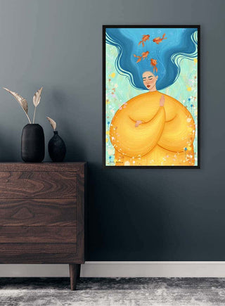 Feeling Fishy by Kate Aitana artwork featuring a woman with blue hair and goldfish, framed on a modern wall.