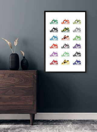 Framed print featuring colorful sneaker illustrations, styled on a grey wall above a modern wood dresser.