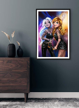 Framed Hot Party Girls Not Frozen artwork by Danii Steinfeldt displayed on a dark wall above a wooden cabinet.