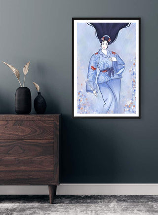 Framed artwork "The Japanese Woman" by Kate Aitana displayed on a grey wall above a wooden dresser.