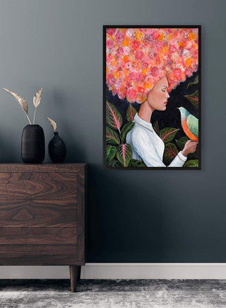 Framed art print of "Quand L'eleve Est Pret" by Sylvie Demers displayed on a dark wall above a wooden dresser.