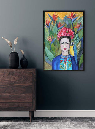 Colorful portrait painting with floral background, framed and displayed above a wooden dresser in a modern room.