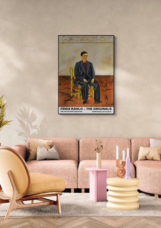 Frida Kahlo's "Portrait with Cropped Hair" displayed above a modern beige sofa in a stylish living room.