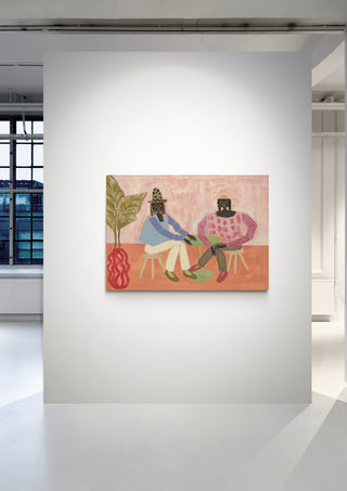 Colorful artwork of two seated figures and a plant, displayed in a modern gallery space for Studio IMO's With a Friend.