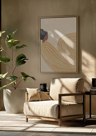 Framed print of "The Woman With the Orange Stripes" by Bea Muller hanging above a beige armchair in a sunlit room.