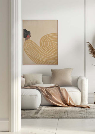Modern living room with a framed "The Woman With the Orange Stripes" by Bea Muller hanging above a white sofa.