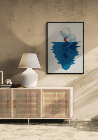 Framed Lovers - Martin Zen artwork featuring two figures and blue reflections, displayed above a sideboard in a modern room.