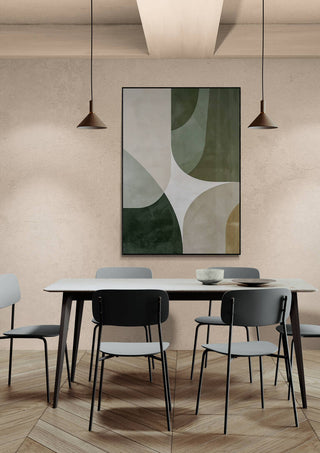 Framed abstract Parallel Universes artwork with green and white shapes hung above a modern dining table set.