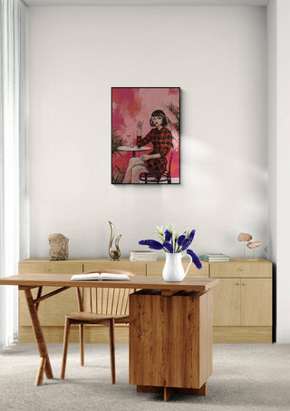 Smoking Red - Tara Green art print displayed above a minimalist desk and wooden chair in a modern room.