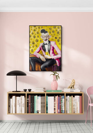 Framed "Party Time" by Martin Zen on pink wall above modern shelf with books, lamp, and decor items.