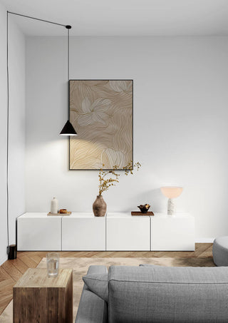 Minimalist living room with Organic Unfolding artwork above a white cabinet, featuring neutral decor and soft lighting.