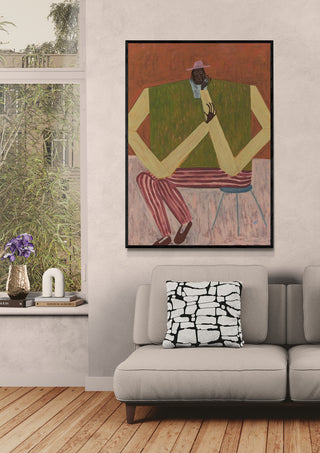 Framed "Take a Moment" artwork by Studio IMO displayed above a modern sofa in a stylish living room.