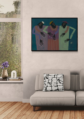 Framed "My People" artwork by Studio IMO on a living room wall above a beige sofa with patterned cushion.