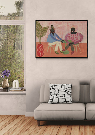 Framed "With a Friend" artwork by Studio IMO hanging above a beige sofa in a modern living room.