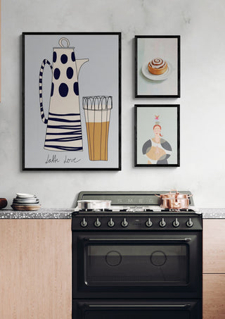 Modern kitchen with framed art of a cinnamon roll above a stove, creating a cozy baking atmosphere.