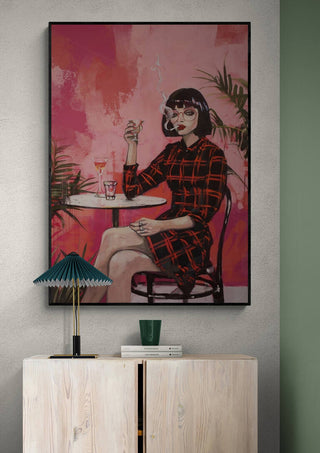 Framed Smoking Red - Tara Green artwork featuring a woman smoking at a table, displayed above a modern cabinet.