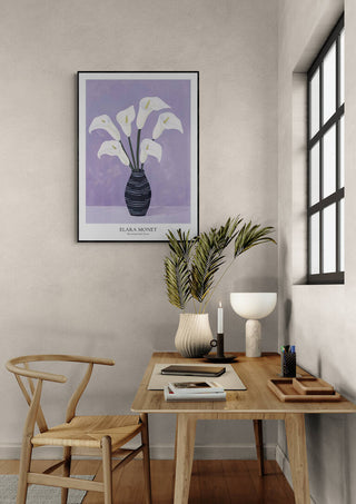Framed "Blossoming Purple Dreams" by Elara Monet hangs above a minimalist wooden desk and chair in a modern room.