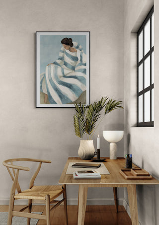 Framed Cherish - Elara Monet art above a modern wooden desk with decor in a minimalist home office.